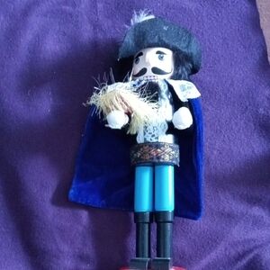 Colorful Nutcracker Figurine with Blue Cape